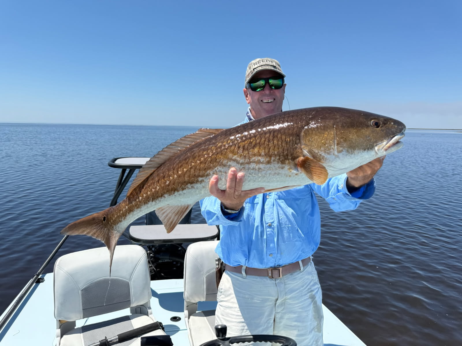 A Tampa Bay angler with a redfish aboard his boat
